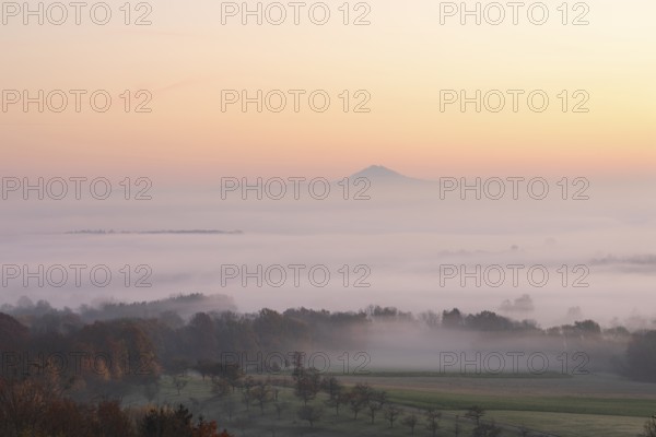 Hohenstaufen in the golden morning light, Aichelberg. Spectacular dawn over the foggy foothills of Alb