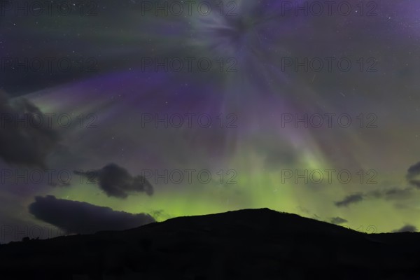 Northern lights at dawn at Sørfolda Fjord near Kjerringøy between Bodø and Sørfold in Norway