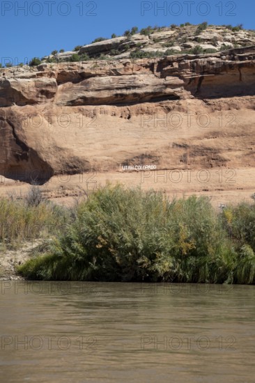 Loma, Colorado - Letters carved into the rock above the Colorado River mark the boundary between the states of Colorado and Utah