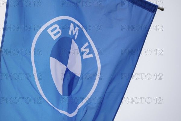 Flag with BMW logo on a car dealership
