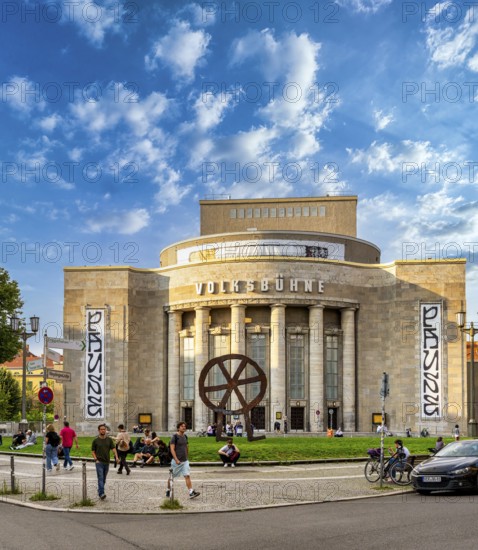 The Robber Wheel, metal sculpture and logo of Volksbühen Berlin, made in 1994 by Swiss sculptor Rainer Haußmann, Rosa Luxemburg Platz, Berlin, Germany