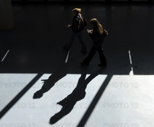 Foyer in a building of the Technical University of Berlin, light and shadow from people at the Marchstraße exit, Berlin, Germany