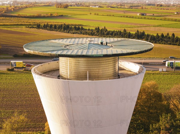 Close-up of a water tower surrounded by fields in an autumn setting, Möglingen water tower, Germany