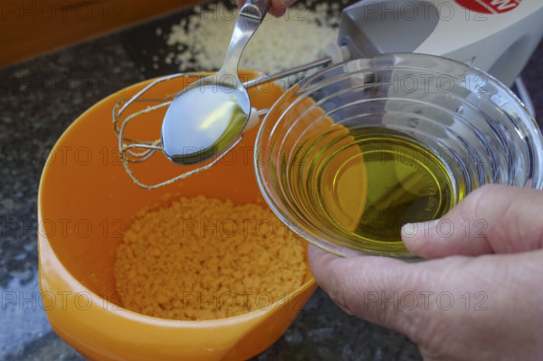 Southern German cuisine, preparing aioli, garlic cream, mayonnaise, oil and minced egg, men's hands, hand mixer, studio, food photography, Germany