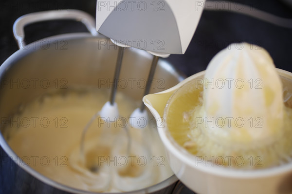 Swabian cuisine, preparation mass for oven slippery, sweet main course or dessert, dessert, typical Swabian, hand mixer, stir in lemon juice into mass, citrus press, cooking pot, traditional cuisine, food photography, studio, Germany