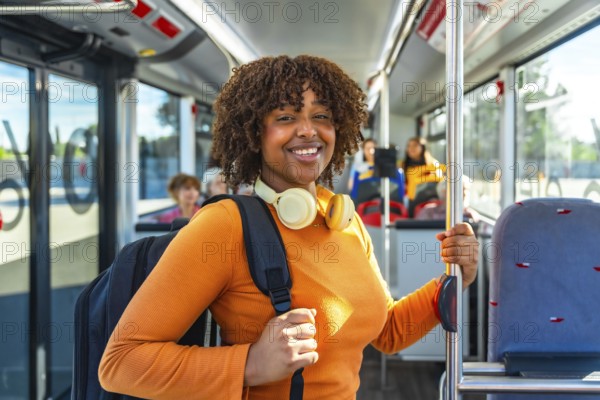 Smiling black woman commuter standing on a city bus, headphones on and backpack ready, embodying urban studentyoung professional lifestyle, eco friendly public transit commute