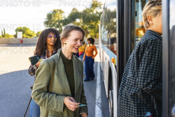 Happy woman smiling with bus ticket in hand, waiting in line to board a city bus for her daily commute using sustainable public transportation
