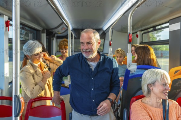 Diverse group of people, including seniors and children, commuting and traveling together inside a modern city bus enjoying social interaction and a comfortable journey