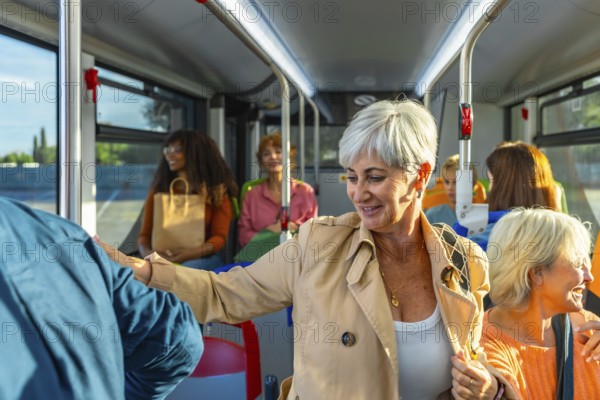 Diverse group of women commuters chatting and smiling on a city bus, enjoying a daytime ride together multi ethnic friends and active seniors sharing conversation and connection