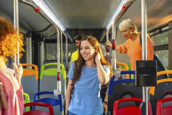 Diverse commuters stand and ride a bright city bus, holding handrails and chatting as they travel to work or around town, capturing everyday urban public transport life