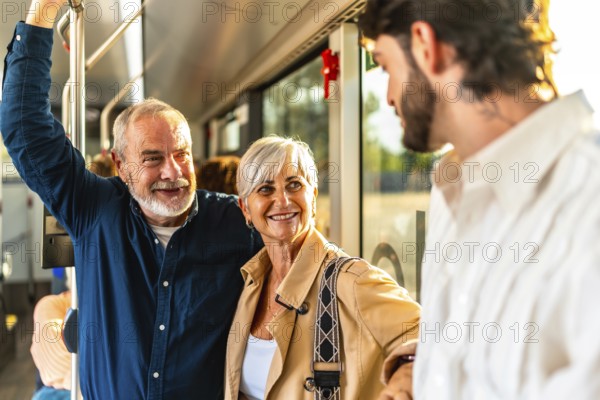 Happy senior couple chatting with a young man while riding a modern city bus, smiling and enjoying their urban journey, social connection and relaxed weekend commute