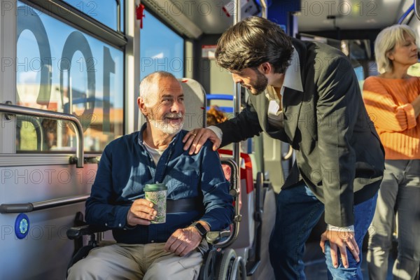 Young man offering assistance and support to a smiling senior man using a wheelchair while traveling on a public bus, highlighting care and accessibility within the community