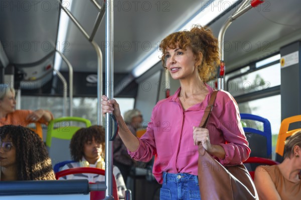 Mature woman standing and holding onto a pole inside a city bus, commuting to work or journeying through the urban environment, using sustainable transportation