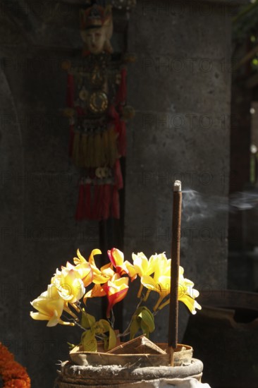 Flowers and incense sticks arranged for beautiful offerings, Bali, Indonesia