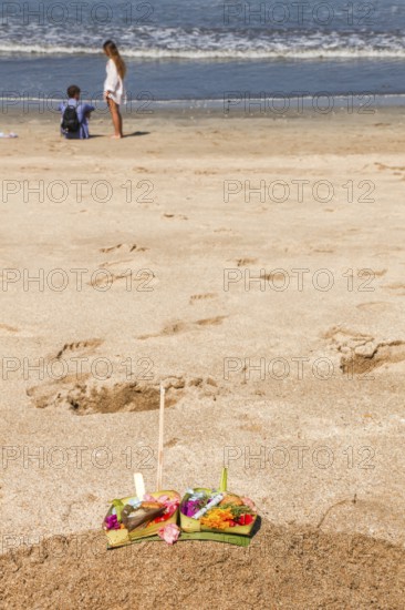 Canang Sari is a Balinese offering that expresses Wasa (God) or the creators of life to Sang Hyang Widhi. The offerings are used to balance and maintain peace on earth, between good and evil, between gods and demons, between heaven and hell, Kuta beach, Bali, Indonesia
