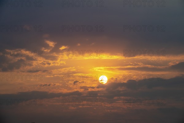 Dramatic sunset with clouds and sun, Etosha National Park, Namibia