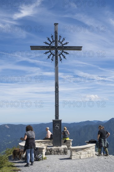 Summit cross with tourists, Brauneck 1555m, Bavarian Prealps, Isarwinkel, Lenggries, Upper Bavaria, Bavaria, Germany