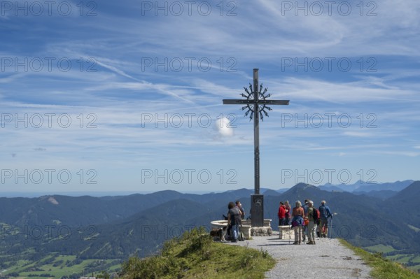 Summit cross with tourists, Brauneck 1555m, Bavarian Prealps, Isarwinkel, Lenggries, Upper Bavaria, Bavaria, Germany