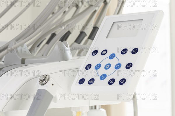 A close-up view of a dental equipment control panel showcasing various settings. This setup is commonly found in dental clinics, ensuring smooth operations during patient care