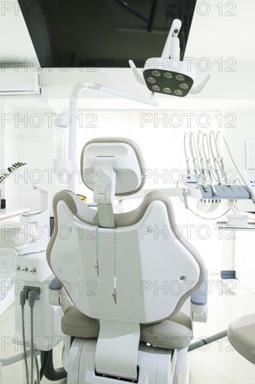 Modern dental clinic with a comfortable chair and equipment for patient care in a bright, clean environment