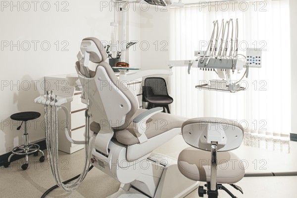 Modern dental clinic interior with equipment and patient chair ready for treatment