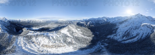 Wonderful winter landscape with Zugspitze, blue sky and snow, mountains and mountain valley, aerial view of Garmisch ski area, Garmisch-Patenkirchen, Bavaria, Germany