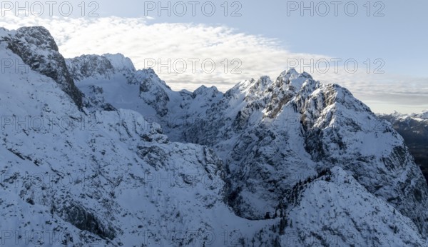 Wonderful winter landscape with Zugspitze and Waxenstein, blue sky and snow, mountains and mountain valley, aerial view, Garmisch-Patenkirchen, Bavaria, Germany