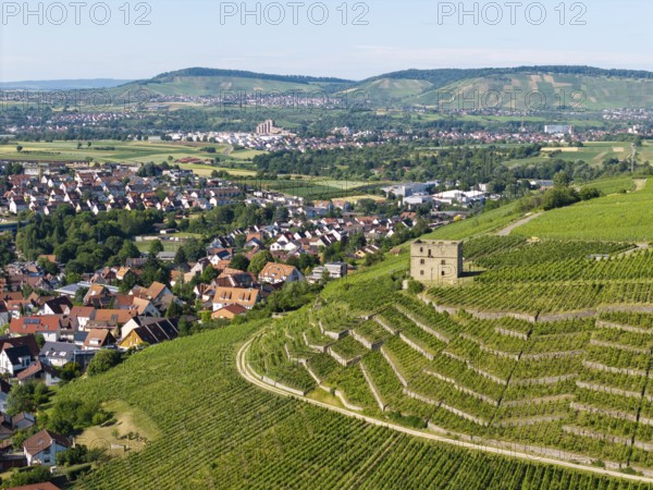 View of vineyards, a stone house and a village against a hilly backdrop, Y-Burg, Stetten im Remstal, Baden-Württemberg, Germany