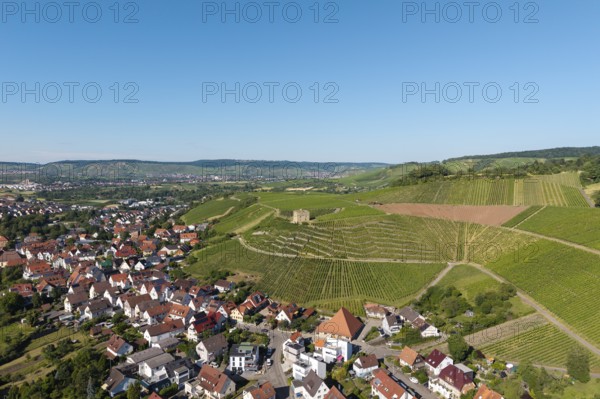 Aerial view of a village next to green vineyards under clear sky, Y-Burg, Stetten im Remstal, Baden-Württemberg, Germany