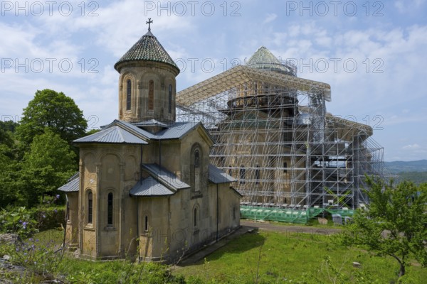 Historic church with scaffolding in green surroundings, presumably a renovation, Gelati monastery near Kutaisi, UNESCO World Heritage Site, Imereti region, Georgia