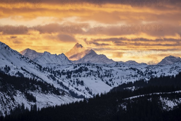 Grossglockner peaks at sunset in winter, spectacular cloudy skies, Hochbrixen, Brixen im Thale, Tyrol, Austria