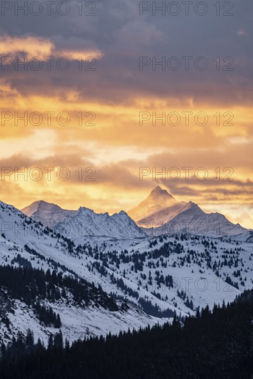 Grossglockner peaks at sunset in winter, spectacular cloudy skies, Hochbrixen, Brixen im Thale, Tyrol, Austria