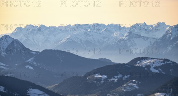 Mountain panorama with peaks of the Karwendel Mountains in winter in evening light, view from the Hohe Salve, Tyrol, Austria