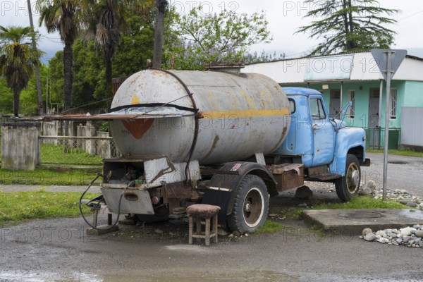 Old truck with gas tank on a rural road in rural area, gas bottles can be filled, Imereti region, Imereti, Georgia