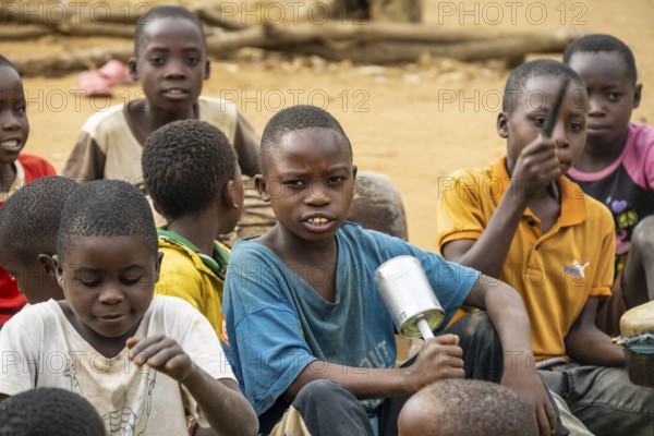 Group of children playing music with rattles, in a Sadaani village, Tanga, Tanzania