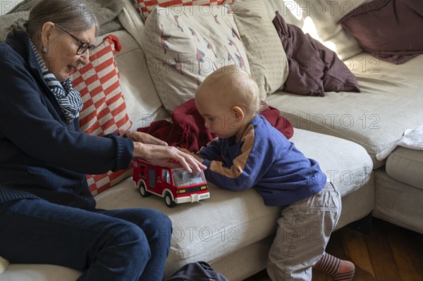 Great-grandmother playing with her great-grandson, two years old, Othenstorf, Mecklenburg-Western Pomerania, Germany