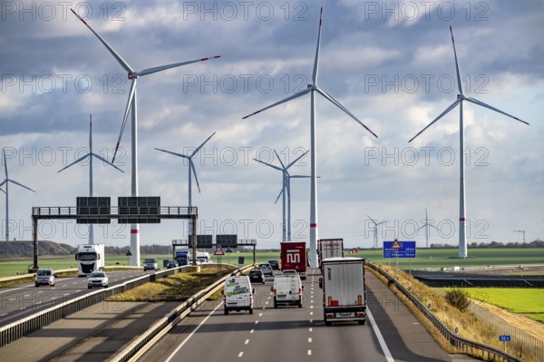 A44 motorway near Bedburg, in front of the Jackerath triangle, recultivated open-cast mining site, Garzweiler open-cast lignite mine, Königshovener Höhe wind farm near Bedburg, operated by RWE and the city of Bedburg, North Rhine-Westphalia, Germany