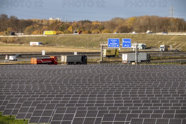 86.5 MW peak open-air photovoltaic systems, from RWE, with over 141, 000 solar modules, on a side strip, along the A44 motorway near Jüchen, at Dreieck Holz, recultivated open-cast mining site, North Rhine-Westphalia, Germany
