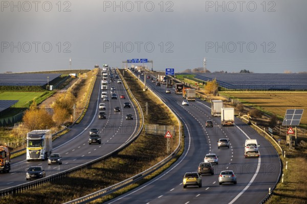 86.5 MW peak open-air photovoltaic systems, from RWE, with over 141, 000 solar modules, on a side strip, along the A44 motorway near Bedburg, at the Jackerath triangle, recultivated open-cast mining site, North Rhine-Westphalia, Germany