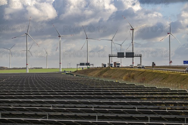 86.5 MW peak open-air photovoltaic systems, from RWE, with over 141, 000 solar modules, on a side strip, along the A44 motorway near Jüchen, at Dreieck Holz, recultivated open-cast mining site, Königshovener Höhe onshore wind farm, operated by RWE and the city of Bedburg, North Rhine-Westphalia, Germany