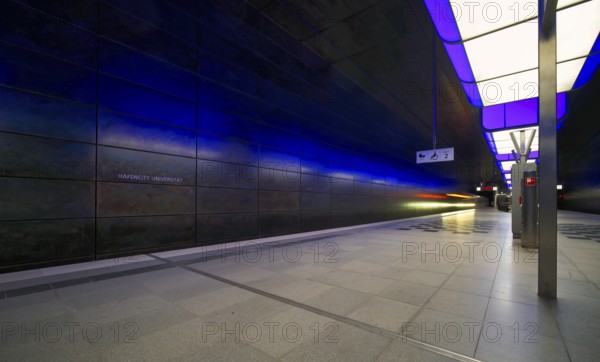 HafenCity University subway station, illuminated in color, blue, underground train, movement effect, U4, empty, platform, stop, train station, subway, sign, boarding area wheelchair user, stroller, public transport, HVV, Hamburger Verkehrsverbund, Hochbahn, public transport, Free and Hanseatic City of Hamburg, Germany