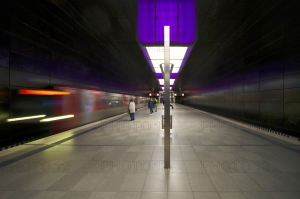 HafenCity University underground station, illuminated in color, purple, underground train, movement effect, U4, travelers, platform, stop, train station, subway, public transport, HVV, Hamburger Verkehrsverbund, Hochbahn, public transport, Free and Hanseatic City of Hamburg, Germany