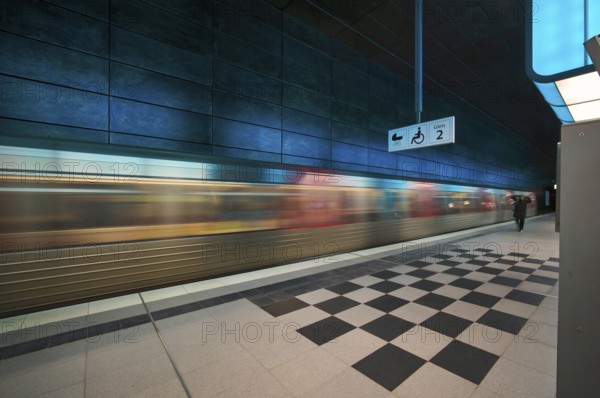 HafenCity University underground station, illuminated in color, blue, underground train, movement effect, U4, platform, stop, train station, subway, sign, boarding area wheelchair user, stroller, public transport, HVV, Hamburger Verkehrsverbund, public transport, Freie und Hanseatic City of Hamburg, Germany