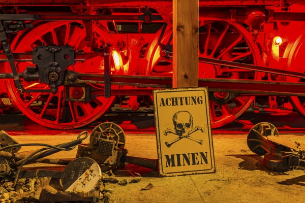 Illuminated wheelwork of a historic locomotive, replica of a mine warning, railway museum, Augsburg railway park, administrative district of Swabia, Bavaria, Germany