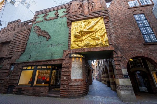 Entrance to Böttcherstraße, golden relief, façade relief The Light Bringer by Roland Hötger, Old Town, Bremen, Germany