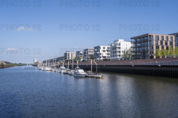Modern residential buildings in Überseestadt, Weser with Marina Europahafen, Bremen, Germany