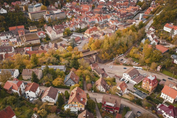 The picture shows the structure of a medieval town surrounded by autumn nature, Calw, Black Forest, Germany