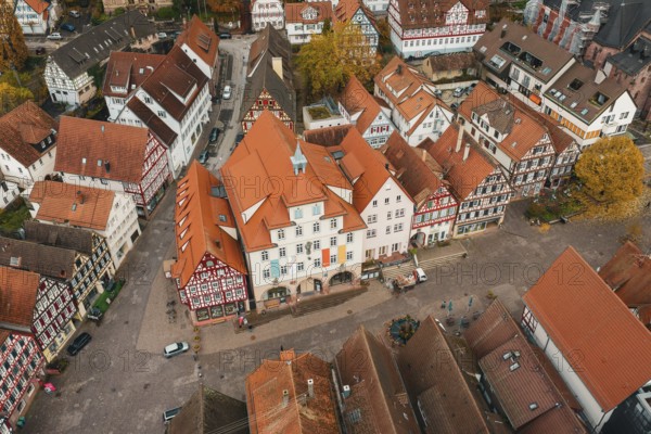 Historic old town with square and surrounding half-timbered houses, lively with pedestrians, Calw, Black Forest, Germany
