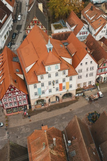 Historic half-timbered houses in an old town with red roofs and an autumn atmosphere, Calw, Black Forest, Germany