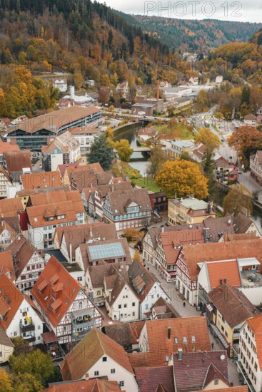 Overview of urban roofs and river in autumn surroundings with half-timbered houses, Calw, Black Forest, Germany